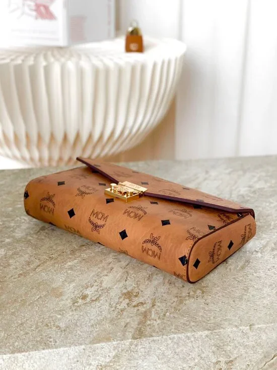 MCM Tan Monogram Clutch with Gold Accent - Picture 7 of 9